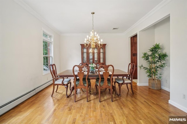 71 Louville Ave, Park Ridge, NJ 07656 - dining room featuring a baseboard heating unit, a chandelier, light wood-style floors, ornamental molding, and baseboards