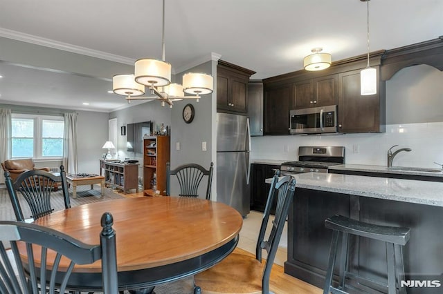 151 Palisade Ave Unit C8, Englewood, NJ 07631 - dining area with ornamental molding and a chandelier