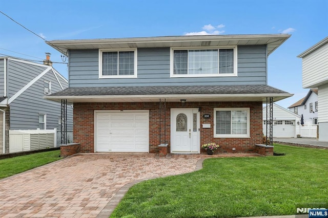 830 Pennsylvania Ave, Lyndhurst, NJ 07071 - view of front of home with brick siding, an attached garage, and decorative driveway