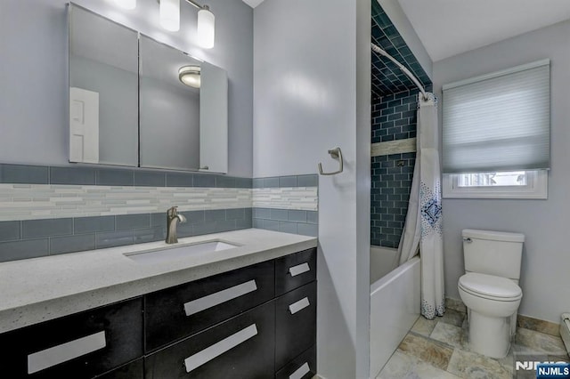 830 Pennsylvania Ave, Lyndhurst, NJ 07071 - bathroom featuring vanity, toilet, shower / bath combo, and backsplash