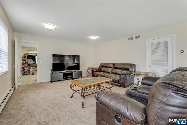 830 Pennsylvania Ave, Lyndhurst, NJ 07071 - living area featuring baseboard heating, light carpet, and baseboards