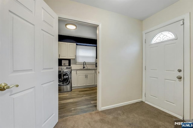 830 Pennsylvania Ave, Lyndhurst, NJ 07071 - carpeted foyer entrance featuring washer / dryer, a sink, and baseboards