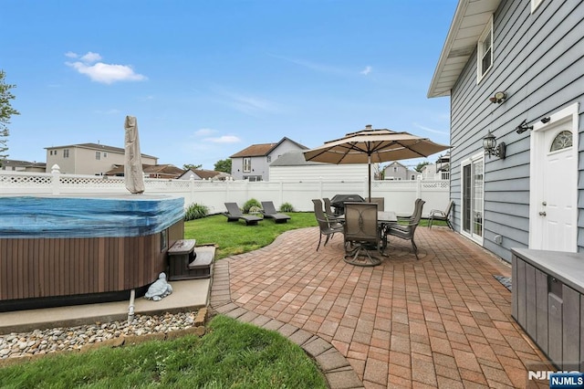830 Pennsylvania Ave, Lyndhurst, NJ 07071 - fenced backyard featuring a hot tub, outdoor dining space, a patio, and a residential view