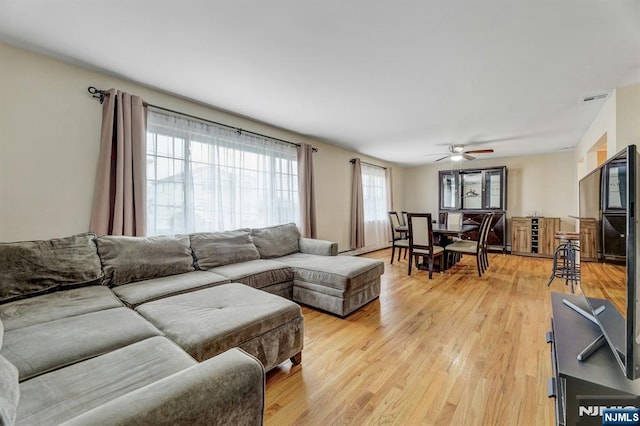830 Pennsylvania Ave, Lyndhurst, NJ 07071 - living room with light wood-style flooring and ceiling fan