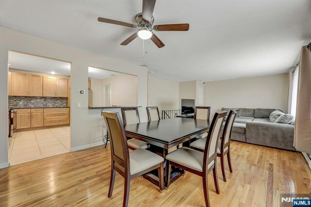 830 Pennsylvania Ave, Lyndhurst, NJ 07071 - dining space with a ceiling fan, light wood-style flooring, and baseboards