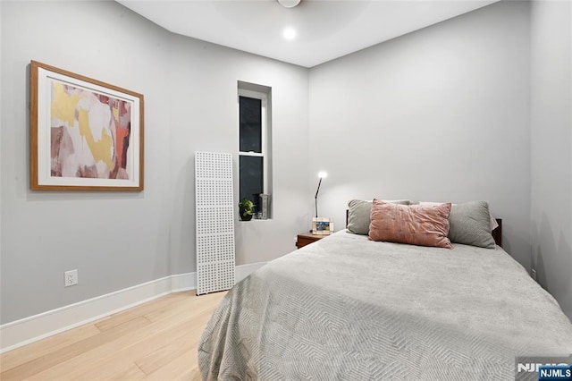 500 Hudson St Unit 2A, Hoboken, NJ 07030 - bedroom with light wood-style flooring, baseboards, recessed lighting, and ceiling fan