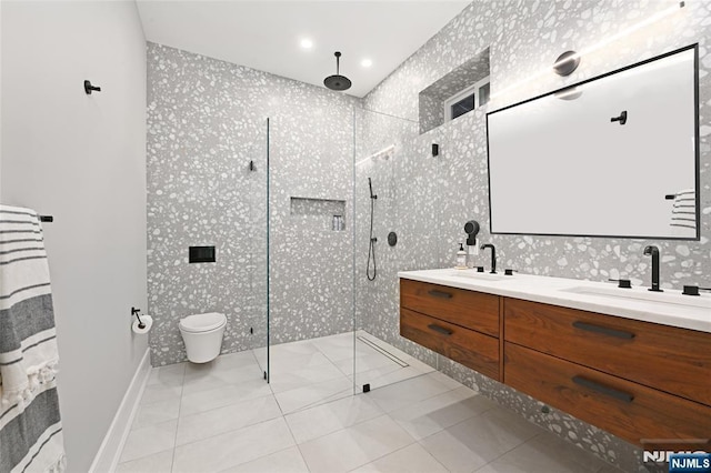500 Hudson St Unit 2A, Hoboken, NJ 07030 - full bathroom with a shower stall, double vanity, toilet, recessed lighting, and wallpapered walls