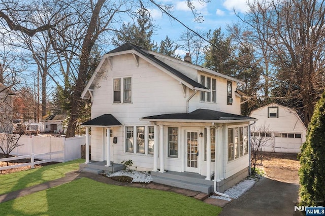 11 Harrington St, Hillsdale, NJ 07642 - rear view of house featuring a detached garage, an outbuilding, a chimney, and driveway