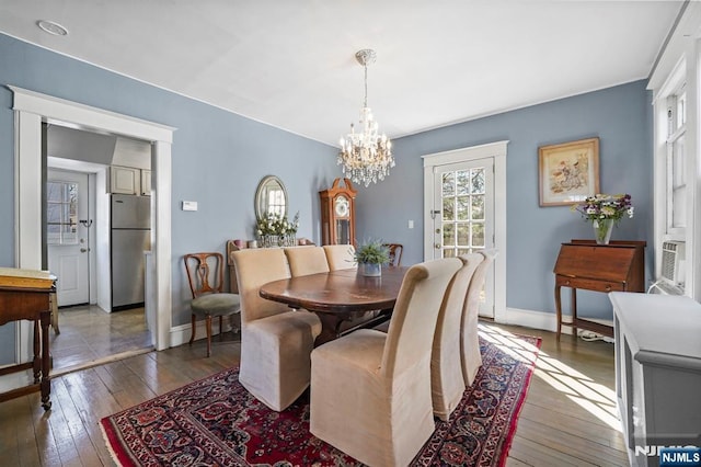 11 Harrington St, Hillsdale, NJ 07642 - dining room with hardwood / wood-style flooring, a chandelier, and baseboards