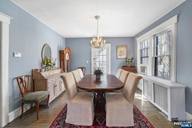 11 Harrington St, Hillsdale, NJ 07642 - dining room featuring a chandelier, plenty of natural light, and dark wood-style flooring