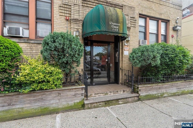 143 Duncan Ave Unit 8/108, Jersey City, NJ 07306 - entrance to property with brick siding and cooling unit