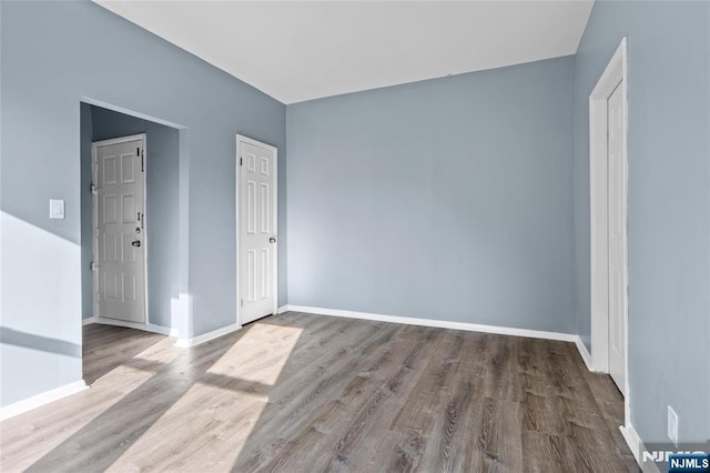 143 Duncan Ave Unit 8/108, Jersey City, NJ 07306 - unfurnished room featuring wood finished floors and baseboards
