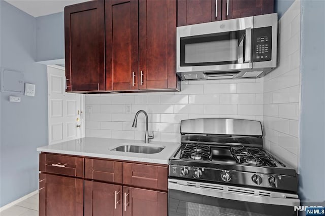 143 Duncan Ave Unit 8/108, Jersey City, NJ 07306 - kitchen with stainless steel appliances, a sink, decorative backsplash, and light countertops