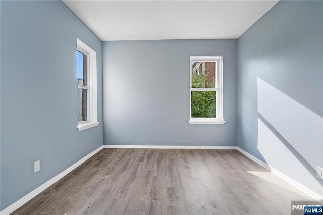143 Duncan Ave Unit 8/108, Jersey City, NJ 07306 - empty room featuring wood finished floors and baseboards