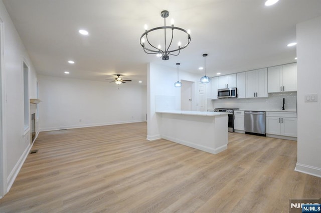 3 Bradshaw Ct Unit 509, Hillsdale, NJ 07642 - kitchen with stainless steel appliances, recessed lighting, a sink, ceiling fan, and a chandelier