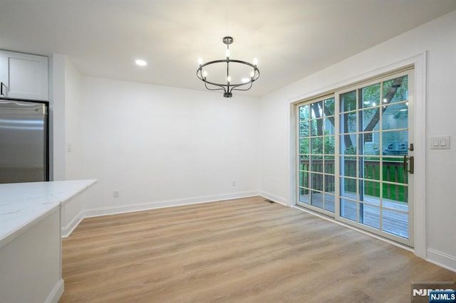 3 Bradshaw Ct Unit 509, Hillsdale, NJ 07642 - unfurnished dining area with a chandelier, baseboards, light wood finished floors, and recessed lighting