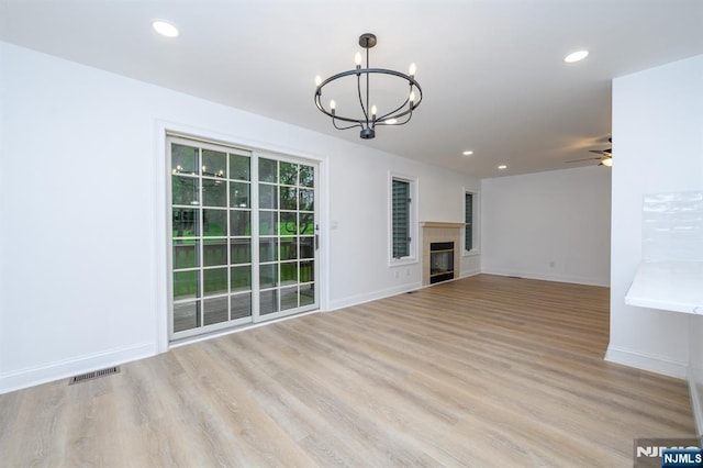 3 Bradshaw Ct Unit 509, Hillsdale, NJ 07642 - unfurnished living room with a chandelier, a ceiling fan, wood finished floors, baseboards, and recessed lighting