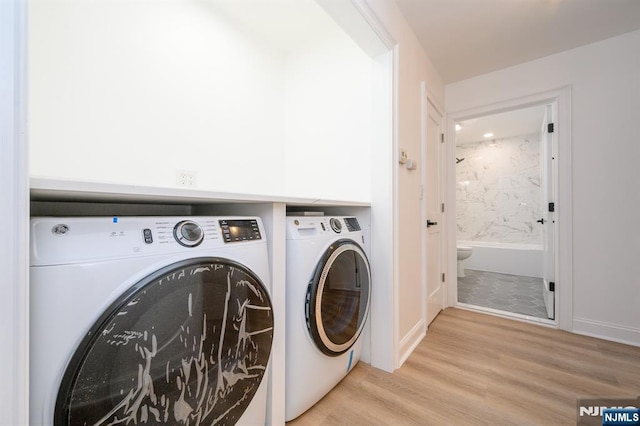 3 Bradshaw Ct Unit 509, Hillsdale, NJ 07642 - laundry room featuring washer and clothes dryer, light wood-type flooring, and baseboards