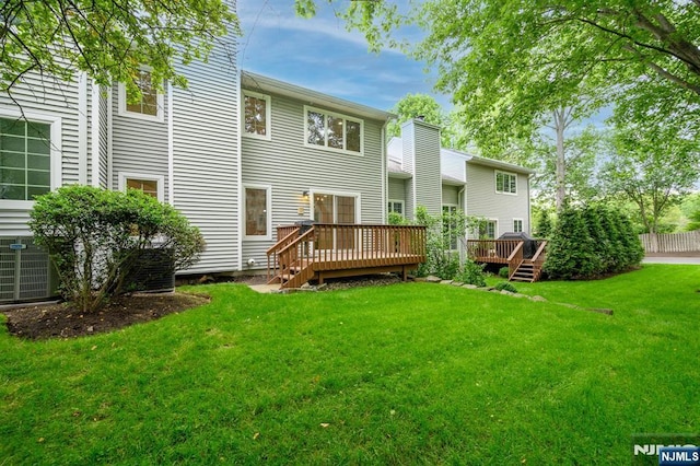 3 Bradshaw Ct Unit 509, Hillsdale, NJ 07642 - rear view of house featuring a deck and a yard