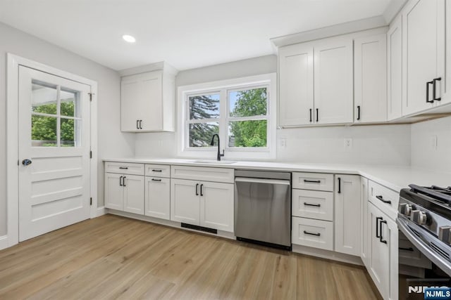 444 Black Oak Ridge Rd, Wayne, NJ 07470 - kitchen with stainless steel appliances, a sink, light wood-style flooring, light countertops, and recessed lighting