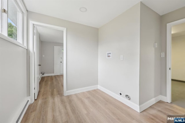 444 Black Oak Ridge Rd, Wayne, NJ 07470 - laundry area with light wood-type flooring, baseboards, washer hookup, electric dryer hookup, and baseboard heating