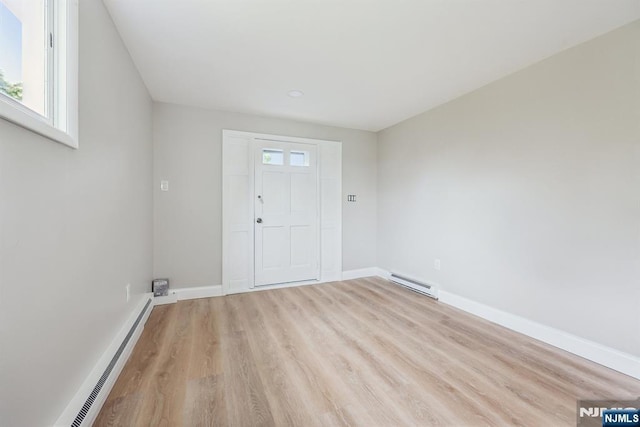 444 Black Oak Ridge Rd, Wayne, NJ 07470 - foyer entrance with a baseboard radiator, a baseboard heating unit, wood finished floors, and baseboards