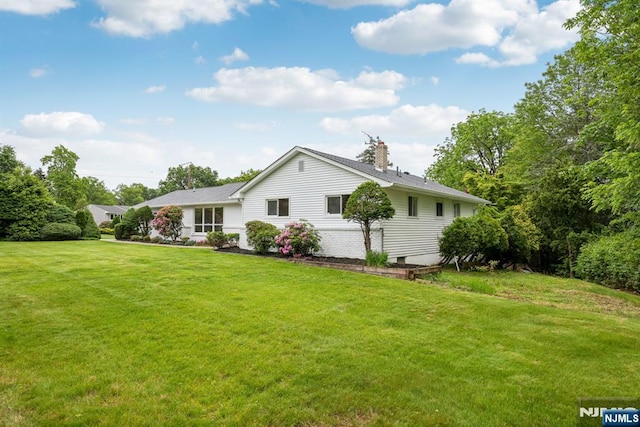 444 Black Oak Ridge Rd, Wayne, NJ 07470 - back of property featuring a chimney and a lawn