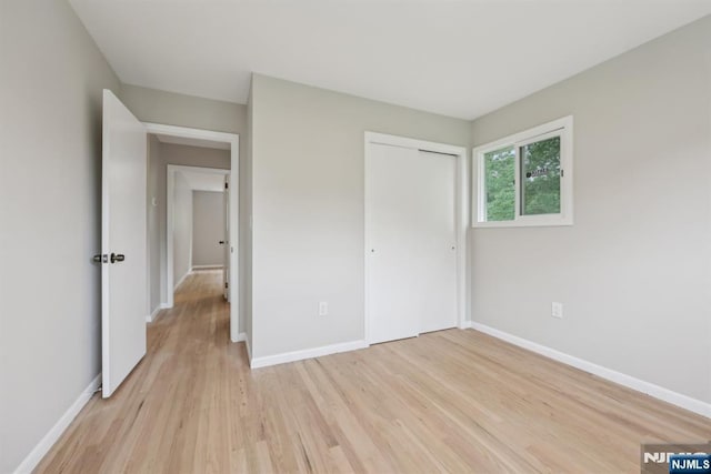 444 Black Oak Ridge Rd, Wayne, NJ 07470 - unfurnished bedroom featuring light wood-style floors, baseboards, and a closet
