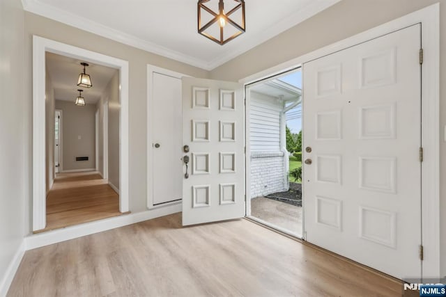444 Black Oak Ridge Rd, Wayne, NJ 07470 - foyer with light wood finished floors, baseboards, and crown molding