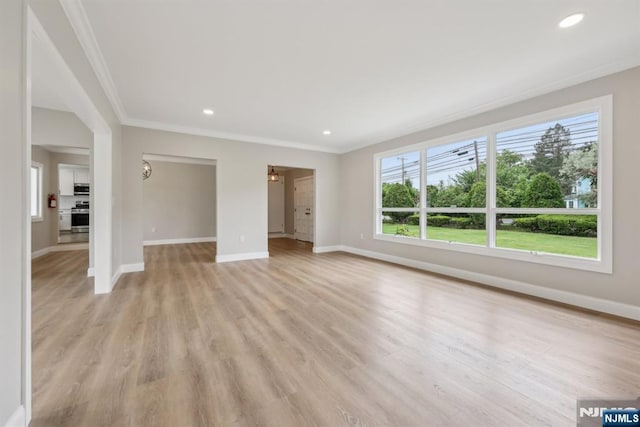 444 Black Oak Ridge Rd, Wayne, NJ 07470 - unfurnished living room featuring ornamental molding, healthy amount of natural light, baseboards, light wood-style floors, and recessed lighting