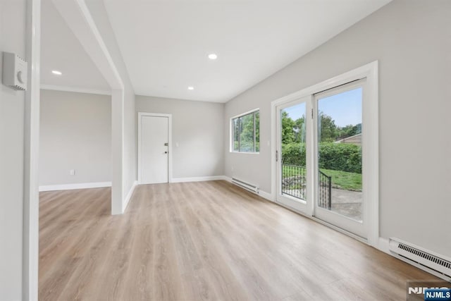444 Black Oak Ridge Rd, Wayne, NJ 07470 - unfurnished living room featuring a baseboard radiator, baseboard heating, light wood-style flooring, baseboards, and recessed lighting