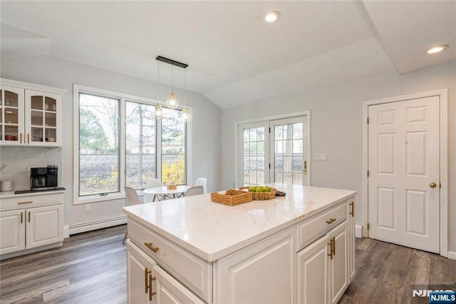 62 Valley Rd, Glen Rock, NJ 07452 - kitchen with lofted ceiling, dark wood-type flooring, white cabinetry, pendant lighting, and glass insert cabinets