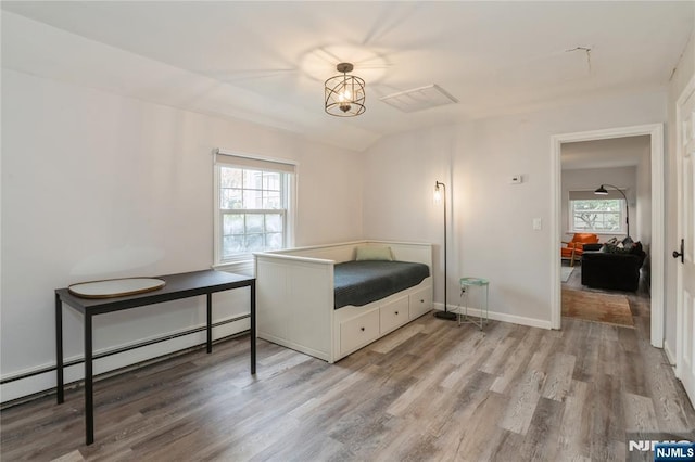 62 Valley Rd, Glen Rock, NJ 07452 - bedroom with a baseboard heating unit, multiple windows, wood finished floors, and baseboards
