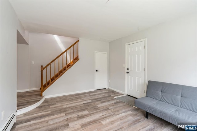 62 Valley Rd, Glen Rock, NJ 07452 - entryway featuring a baseboard heating unit, wood finished floors, stairway, and baseboards