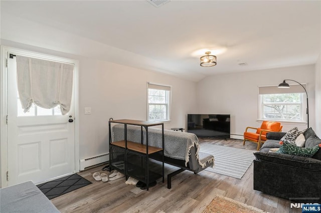 62 Valley Rd, Glen Rock, NJ 07452 - living area with a baseboard radiator and light wood-type flooring