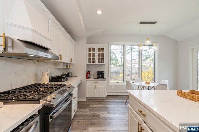 62 Valley Rd, Glen Rock, NJ 07452 - kitchen with stainless steel gas stove, lofted ceiling, wood finished floors, plenty of natural light, and white cabinetry