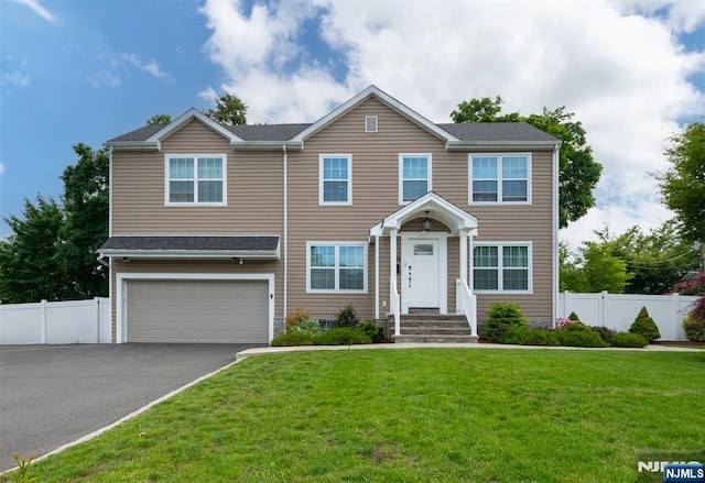 322 E Midland Ave, Paramus, NJ 07652 - view of front of house with an attached garage and driveway