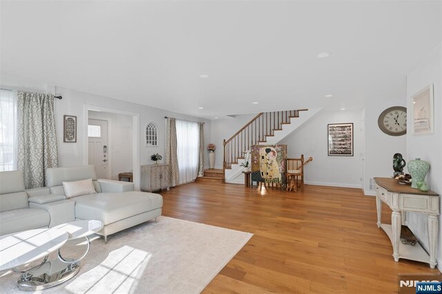 322 E Midland Ave, Paramus, NJ 07652 - living area featuring stairway, light wood-style flooring, recessed lighting, and baseboards