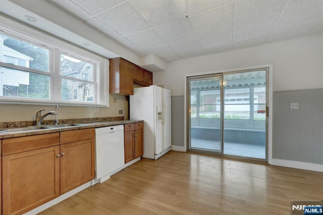 128 Prospect, Midland Park, NJ 07432 - kitchen with white appliances, a sink, light wood-style flooring, and plenty of natural light