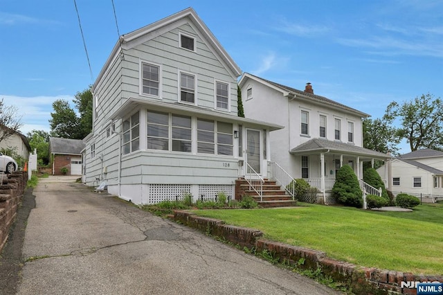 128 Prospect, Midland Park, NJ 07432 - view of front of home featuring a chimney and a front yard