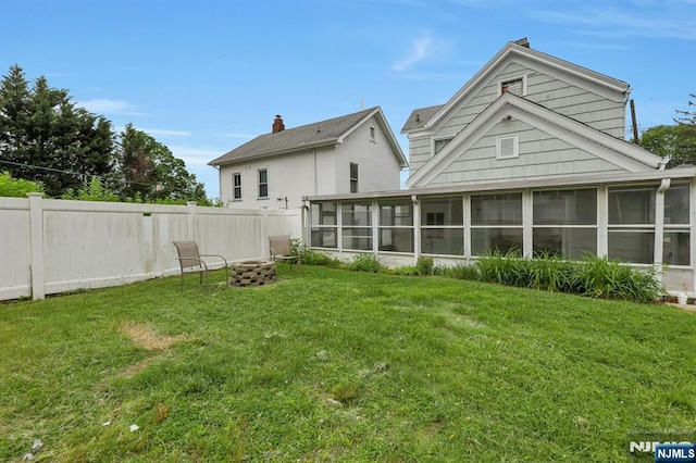 128 Prospect, Midland Park, NJ 07432 - rear view of house with a sunroom and an outdoor fire pit
