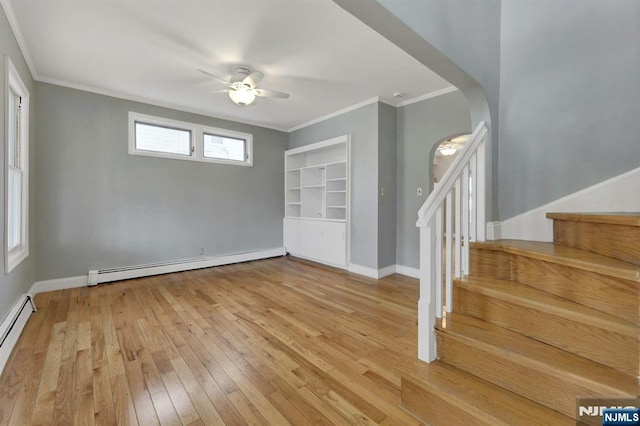 128 Prospect, Midland Park, NJ 07432 - foyer entrance featuring a baseboard radiator, stairway, a ceiling fan, arched walkways, and light wood finished floors