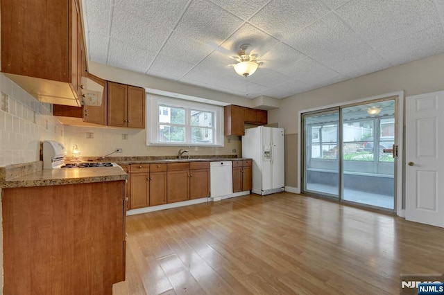 128 Prospect, Midland Park, NJ 07432 - kitchen featuring white appliances, a sink, and brown cabinets