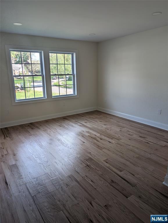 265 Adams Ave, River Edge, NJ 07661 - unfurnished room featuring dark wood finished floors and baseboards