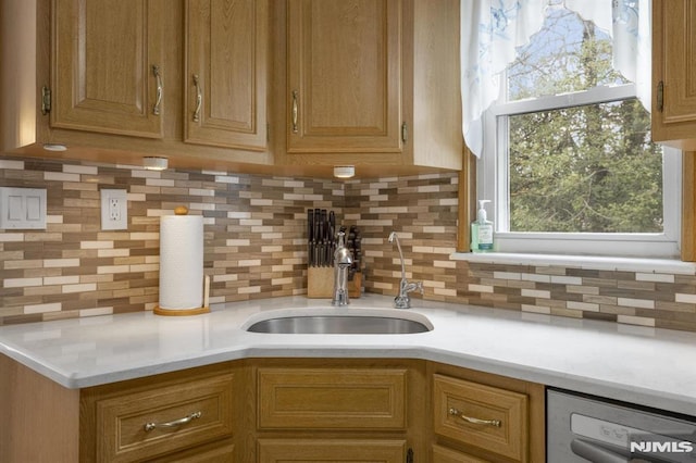 101 Pasadena Pl, Hawthorne, NJ 07506 - kitchen featuring a sink, dishwasher, light countertops, and decorative backsplash
