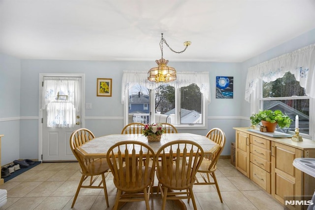 101 Pasadena Pl, Hawthorne, NJ 07506 - dining space with healthy amount of natural light, light tile patterned floors, and a chandelier