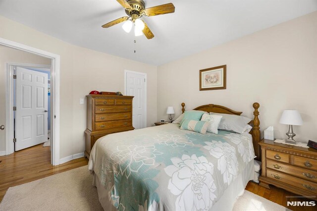 101 Pasadena Pl, Hawthorne, NJ 07506 - bedroom featuring baseboards, wood finished floors, and a ceiling fan