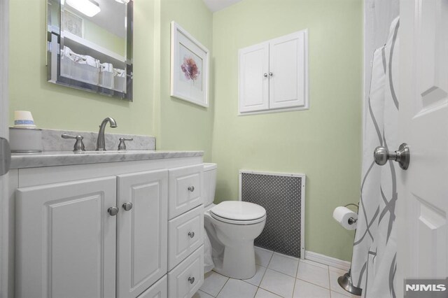 101 Pasadena Pl, Hawthorne, NJ 07506 - bathroom with toilet, tile patterned flooring, vanity, and baseboards