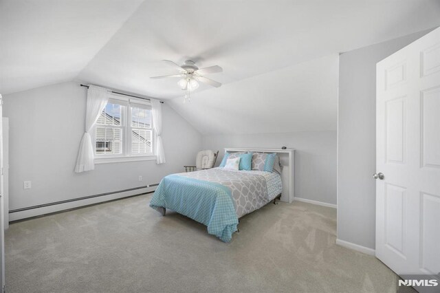 101 Pasadena Pl, Hawthorne, NJ 07506 - bedroom with a baseboard heating unit, carpet flooring, vaulted ceiling, a ceiling fan, and baseboards