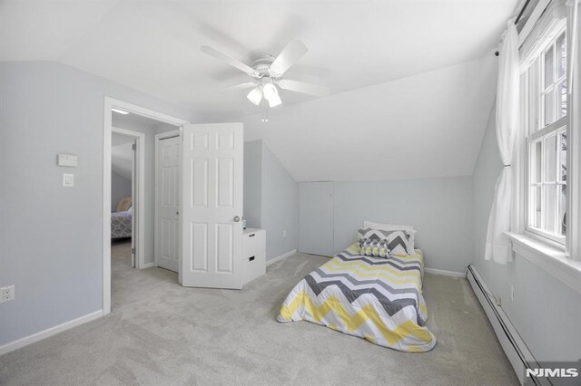 101 Pasadena Pl, Hawthorne, NJ 07506 - carpeted bedroom featuring a baseboard heating unit, lofted ceiling, baseboards, and ceiling fan